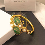Luxury Gold Plated Handcuff with Green Stones & Pearl Detailing for Girls/Women